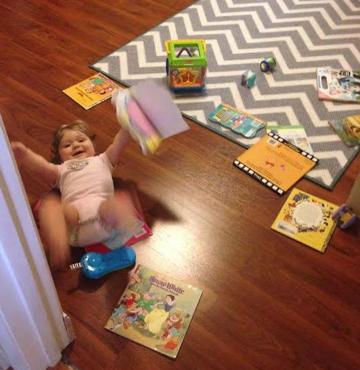 Sweet Pea with scattered books